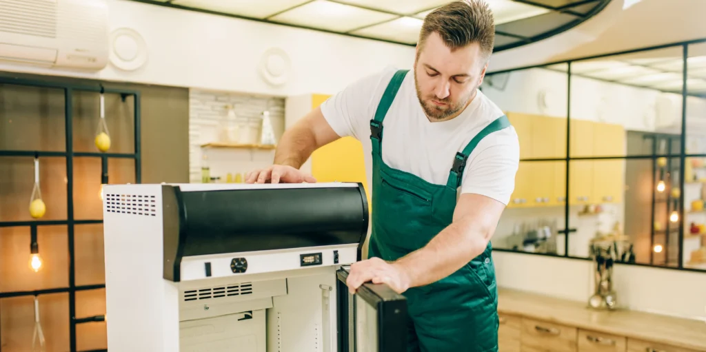 worker with toolbox repair refrigerator home